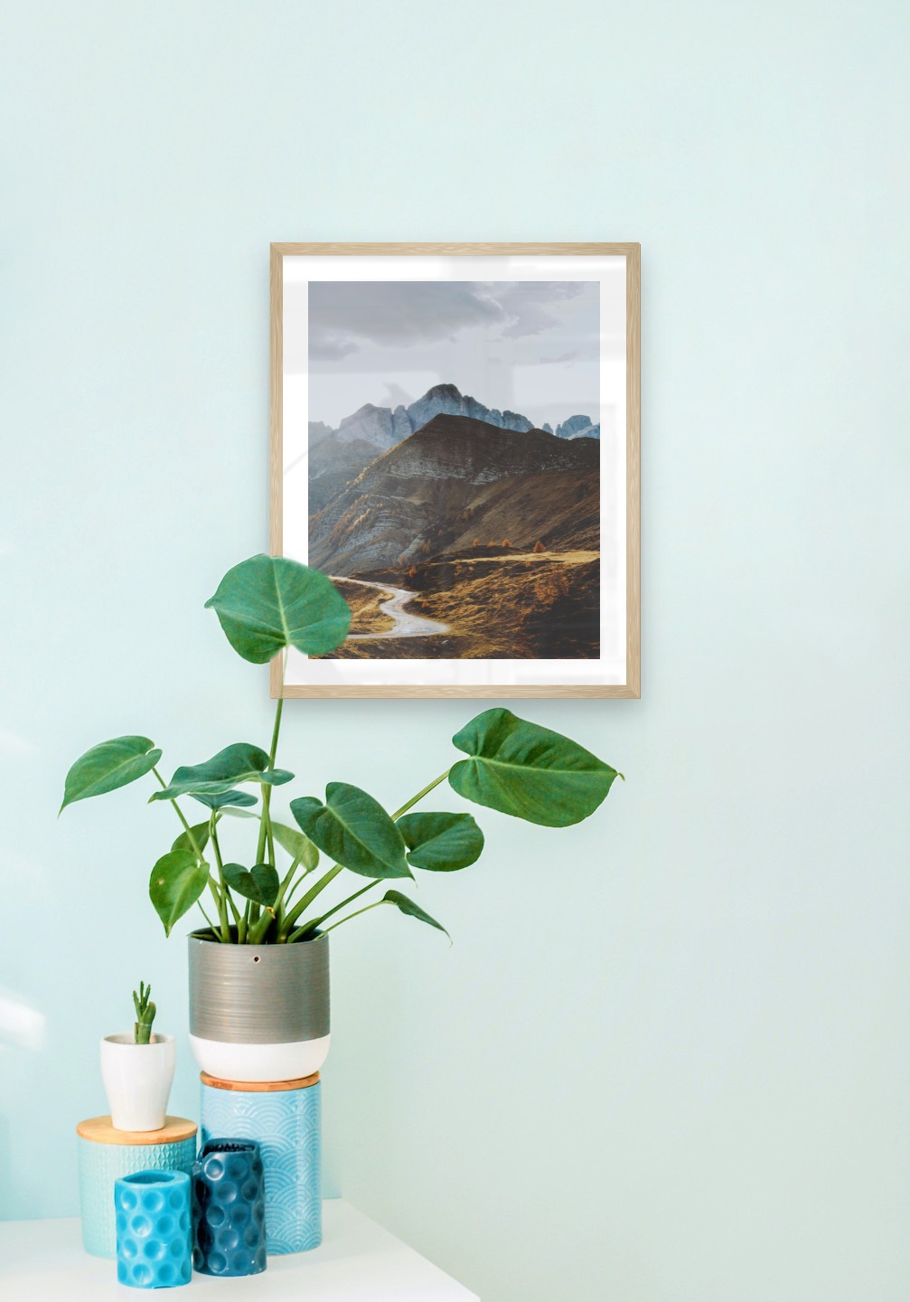 Gallery wall with picture frame in wood in size 40x50 with print "Road among the mountains"