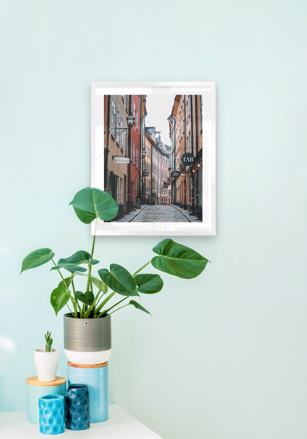 Gallery wall with picture frame in silver in size 40x50 with print "Old town in Stockholm"