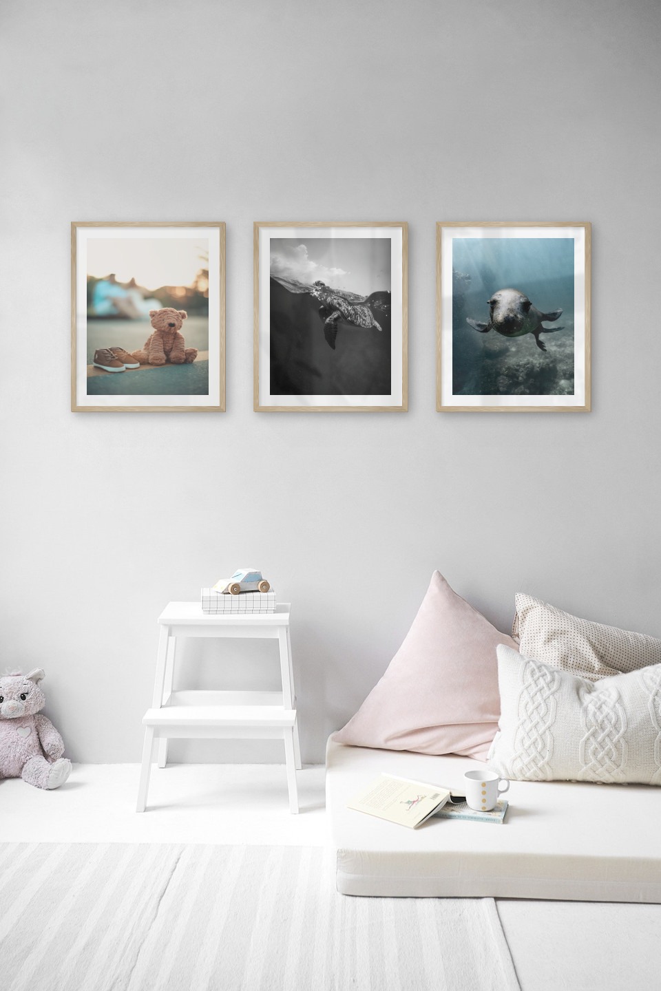 Gallery wall with picture frames in wood in sizes 40x50 with prints "Teddy bear on the street", "Turtle" and "Seal in the water"
