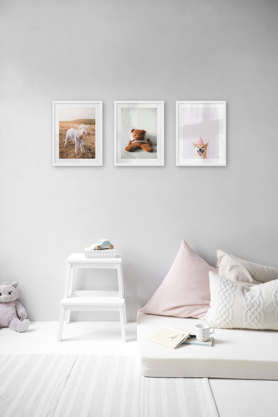 Gallery wall with picture frames in white in sizes 30x40 with prints "Lamb", "Brown teddy bear" and "Dog with pink hat"