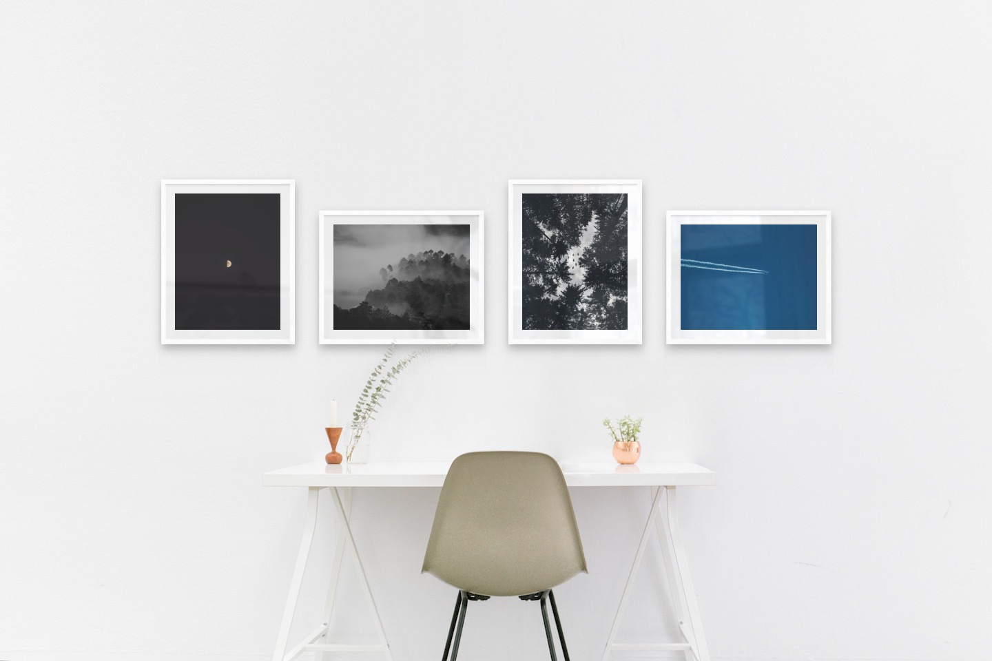 Gallery wall with picture frames in white in sizes 40x50 with prints "The moon", "Foggy wooden tops", "Wooden tops and birds" and "Airplanes in the air"