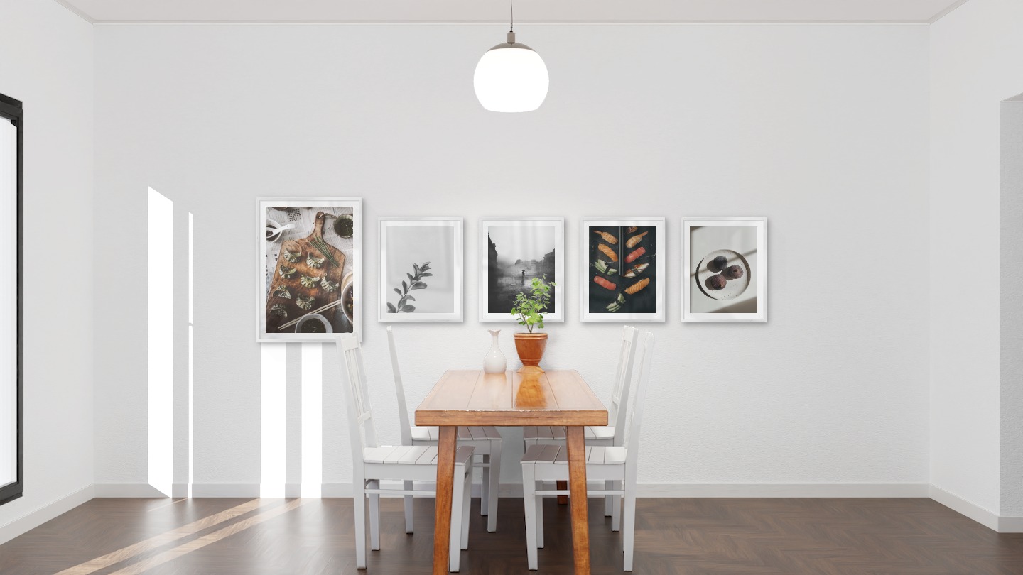 Gallery wall with picture frames in silver in sizes 50x70 and 40x50 with prints "Dumplings", "Twig", "Rainy city", "Sushi" and "Fruit on plate"