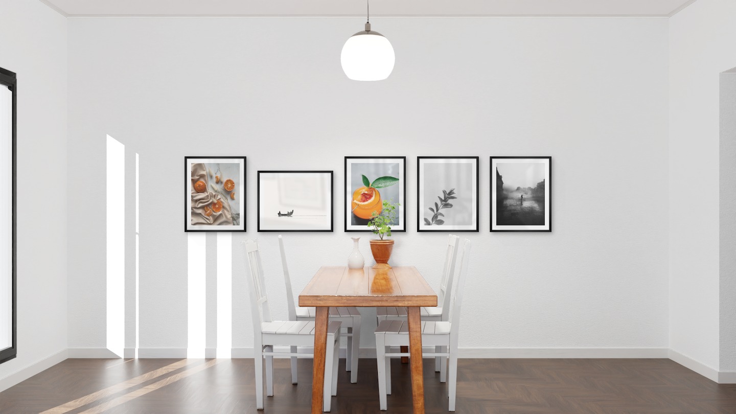 Gallery wall with picture frames in black in sizes 40x50 with prints "Oranges", "People in boat", "Orange drink", "Twig" and "Rainy city"