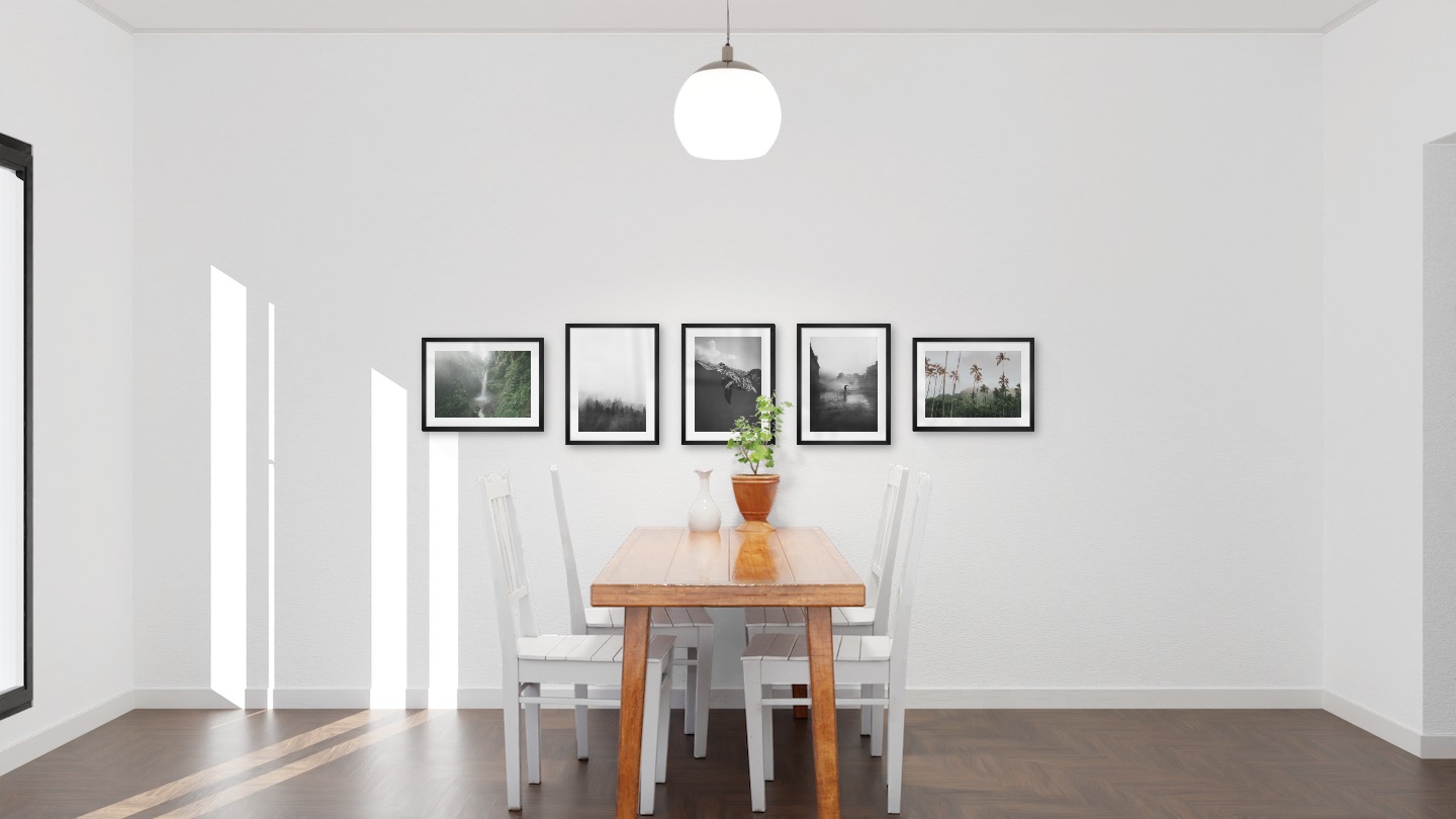 Gallery wall with picture frames in black in sizes 30x40 with prints "Waterfall in forest", "Foggy wooden tops", "Turtle", "Rainy city" and "Palm trees and mountains"