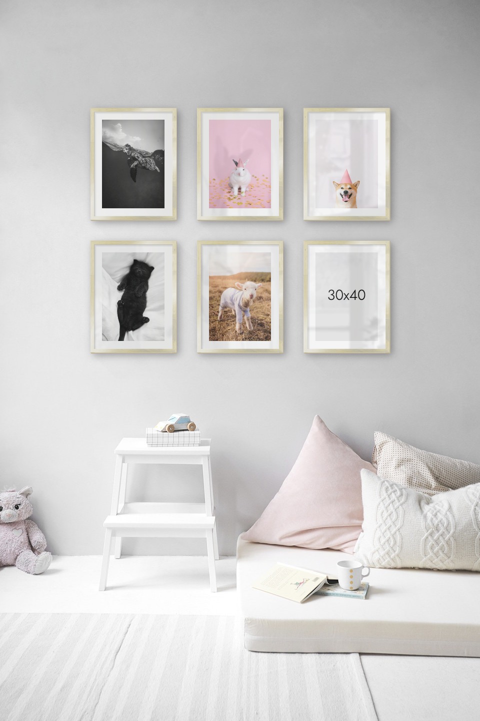 Gallery wall with picture frames in gold in sizes 30x40 with prints "Turtle", "Rabbit with party hat", "Dog with pink hat", "Cat in bed" and "Lamb"