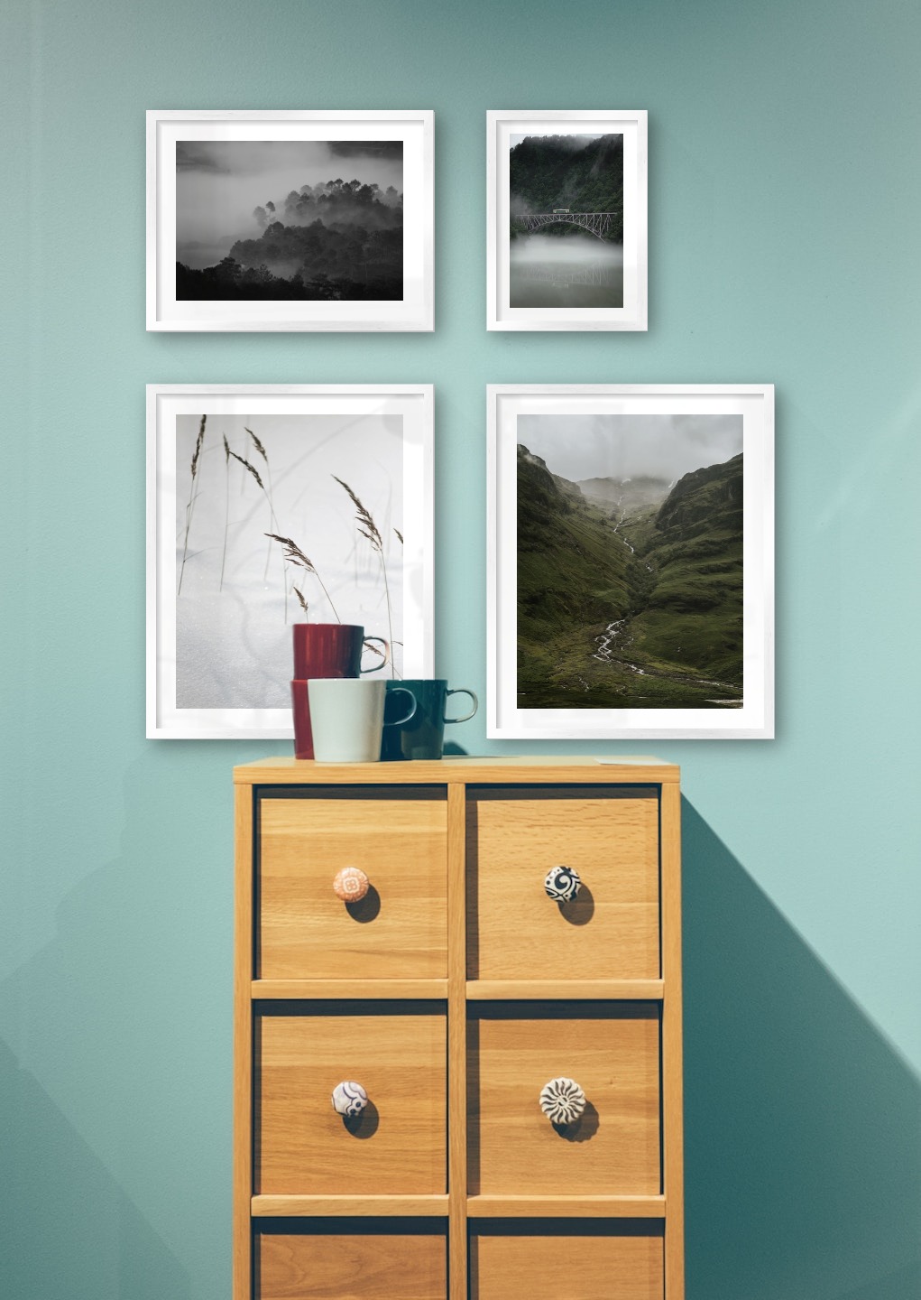 Gallery wall with picture frames in silver in sizes 40x50, 30x40 and 21x30 with prints "Sharp in the snow", "Stream in valley", "Foggy wooden tops" and "Train over bridge"
