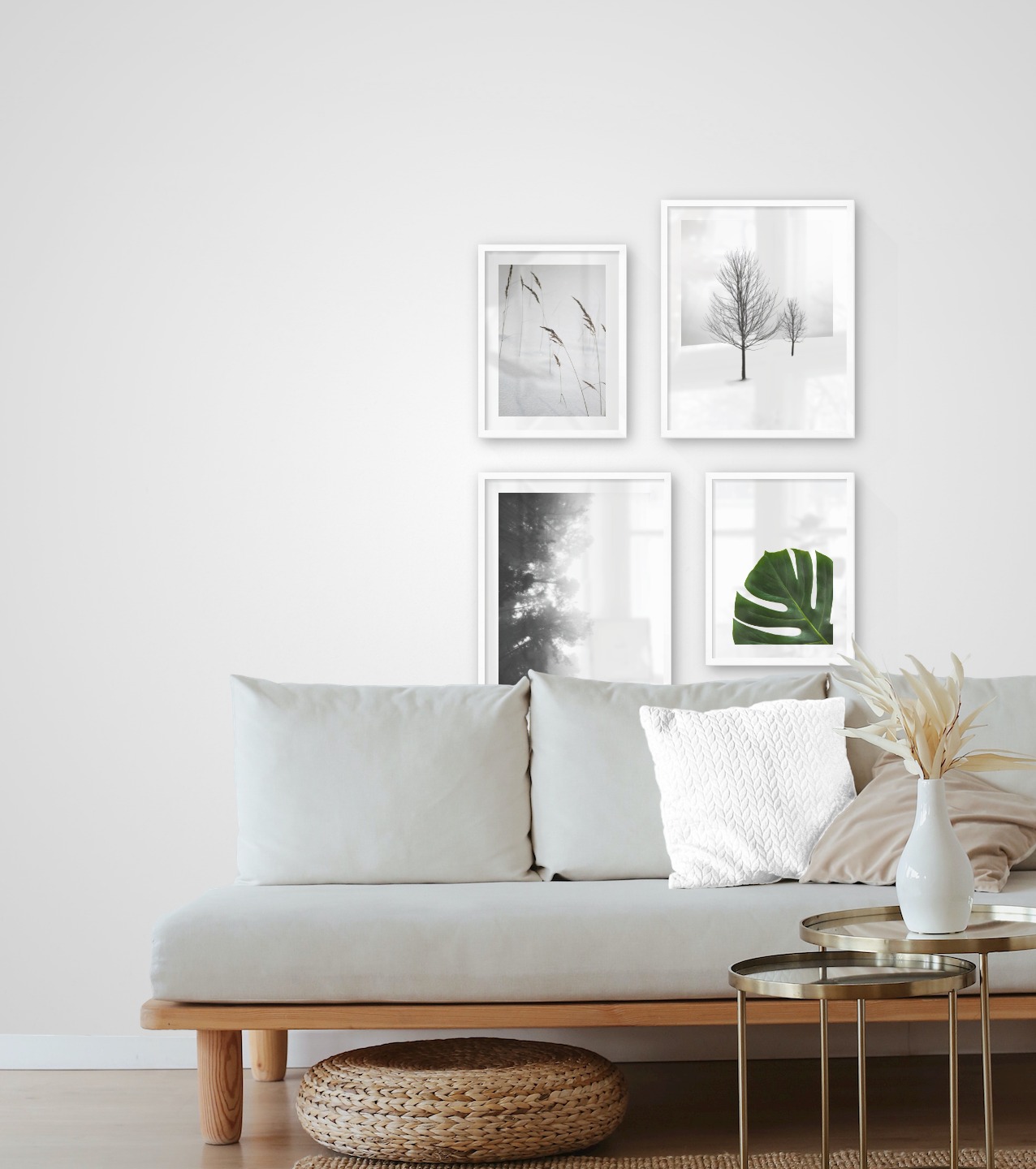Gallery wall with picture frames in white in sizes 30x40 and 40x50 with prints "Sharp in the snow", "Trees in the snow", "Foggy wooden tops from the side" and "Plant"