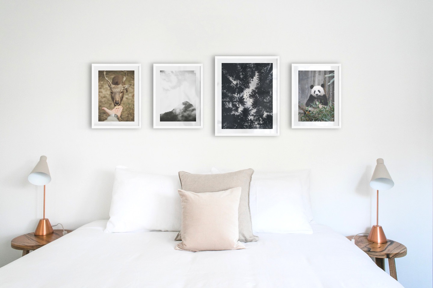 Gallery wall with picture frames in white in sizes 30x40 and 40x50 with prints "Feed a deer", "Trees and mountains in fog", "Wooden tops and birds" and "Panda"