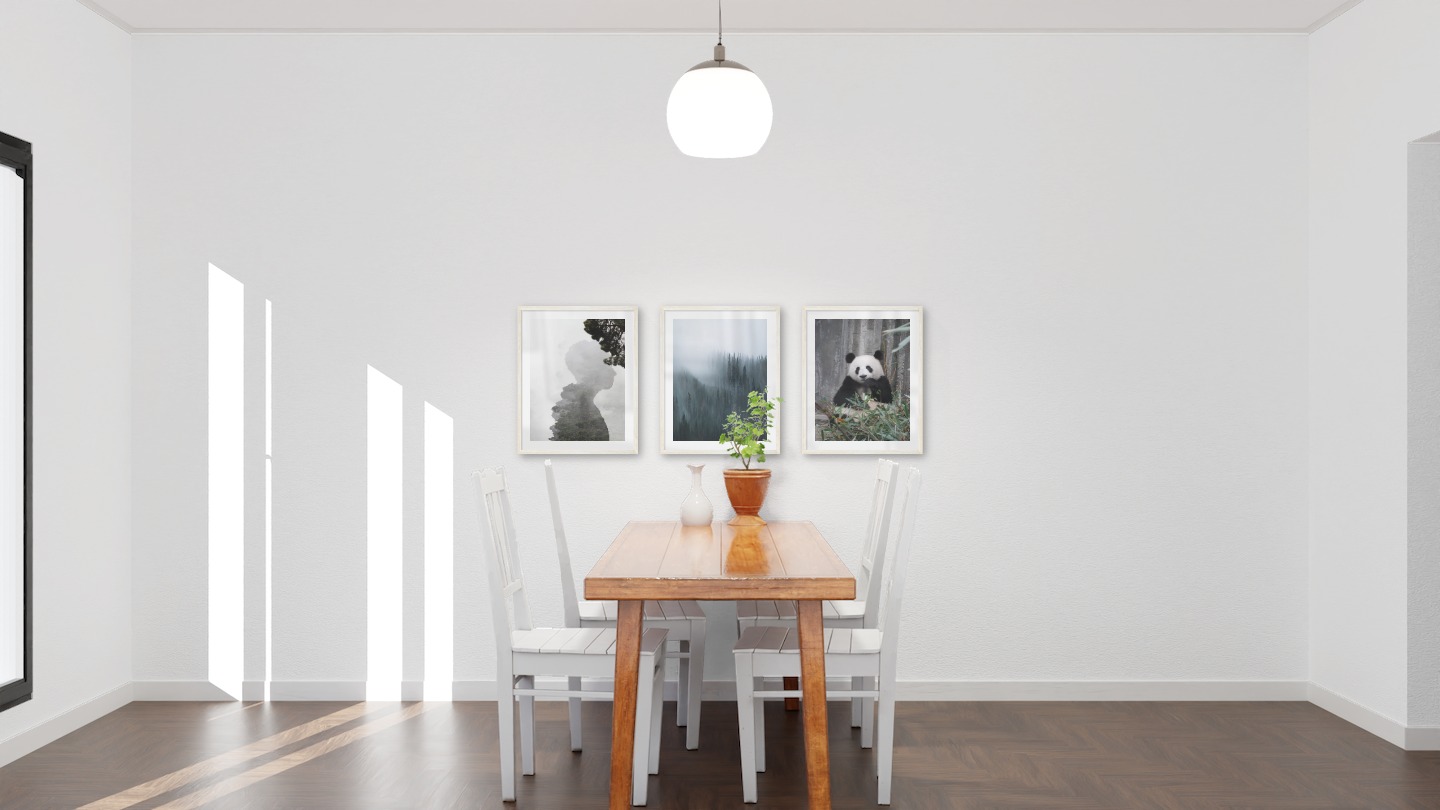 Gallery wall with picture frames in light wood in sizes 40x50 with prints "Silhouette and tree", "Foggy forest" and "Panda"