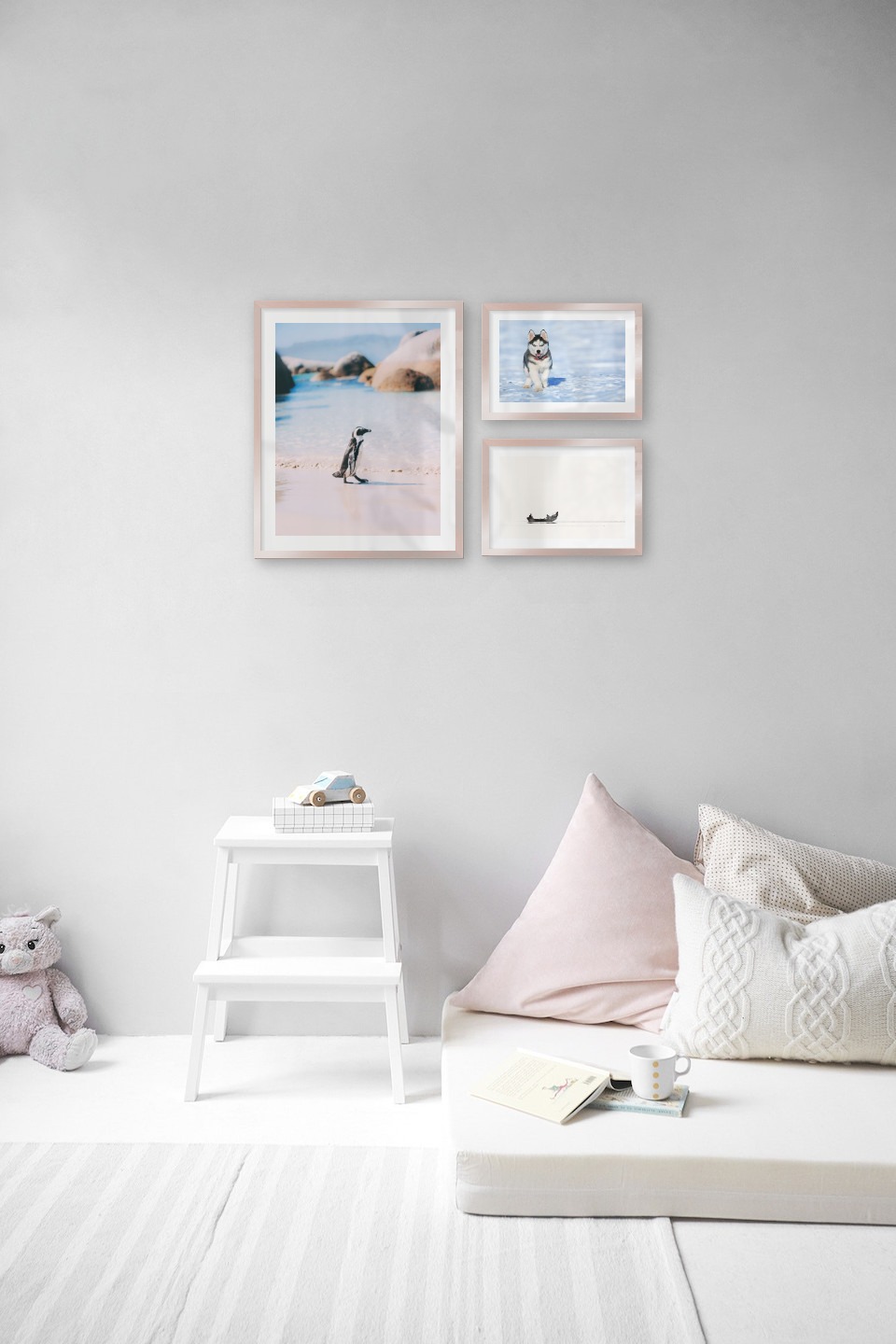 Gallery wall with picture frames in copper in sizes 40x50 and 21x30 with prints "Penguin on the beach", "Husky" and "People in boat"