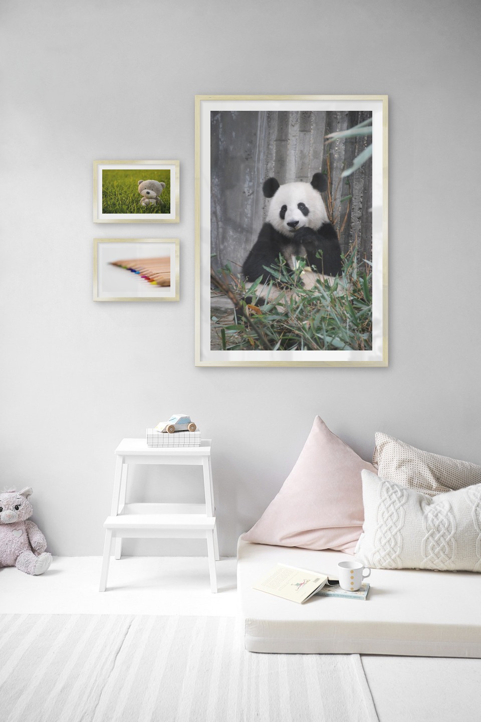 Gallery wall with picture frames in gold in sizes 21x30 and 70x100 with prints "Teddy bear in a field", "Pencils in different colors" and "Panda"