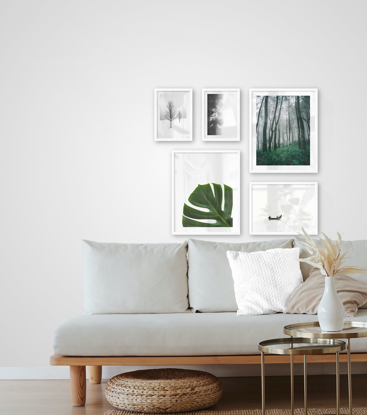 Gallery wall with picture frames in white in sizes 21x30, 40x50 and 30x40 with prints "Foggy wooden tops from the side", "Trees in the snow", "Plant", "Tall trees" and "People in boat"