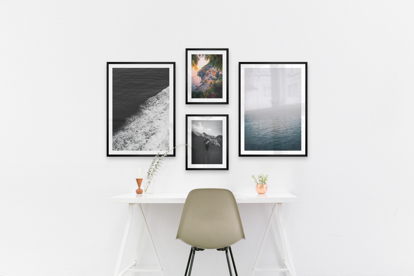 Gallery wall with picture frames in black in sizes 50x70 and 30x40 with prints "Swell from waves", "City by the sea", "Turtle" and "Fog over the sea"