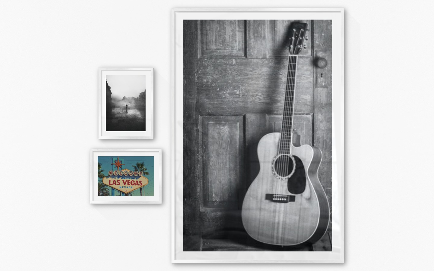 Gallery wall with picture frames in silver in sizes 30x40 and 100x150 with prints "Rainy city", "Las Vegas sign" and "Guitar"