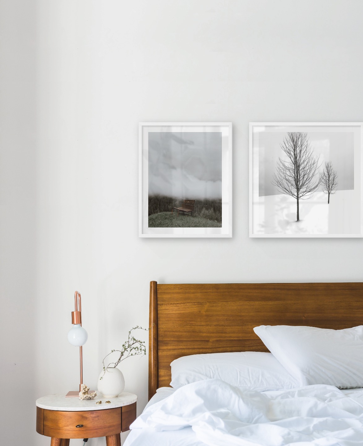 Gallery wall with picture frames in white in sizes 40x50 and 50x50 with prints "Bench in misty nature" and "Trees in the snow"