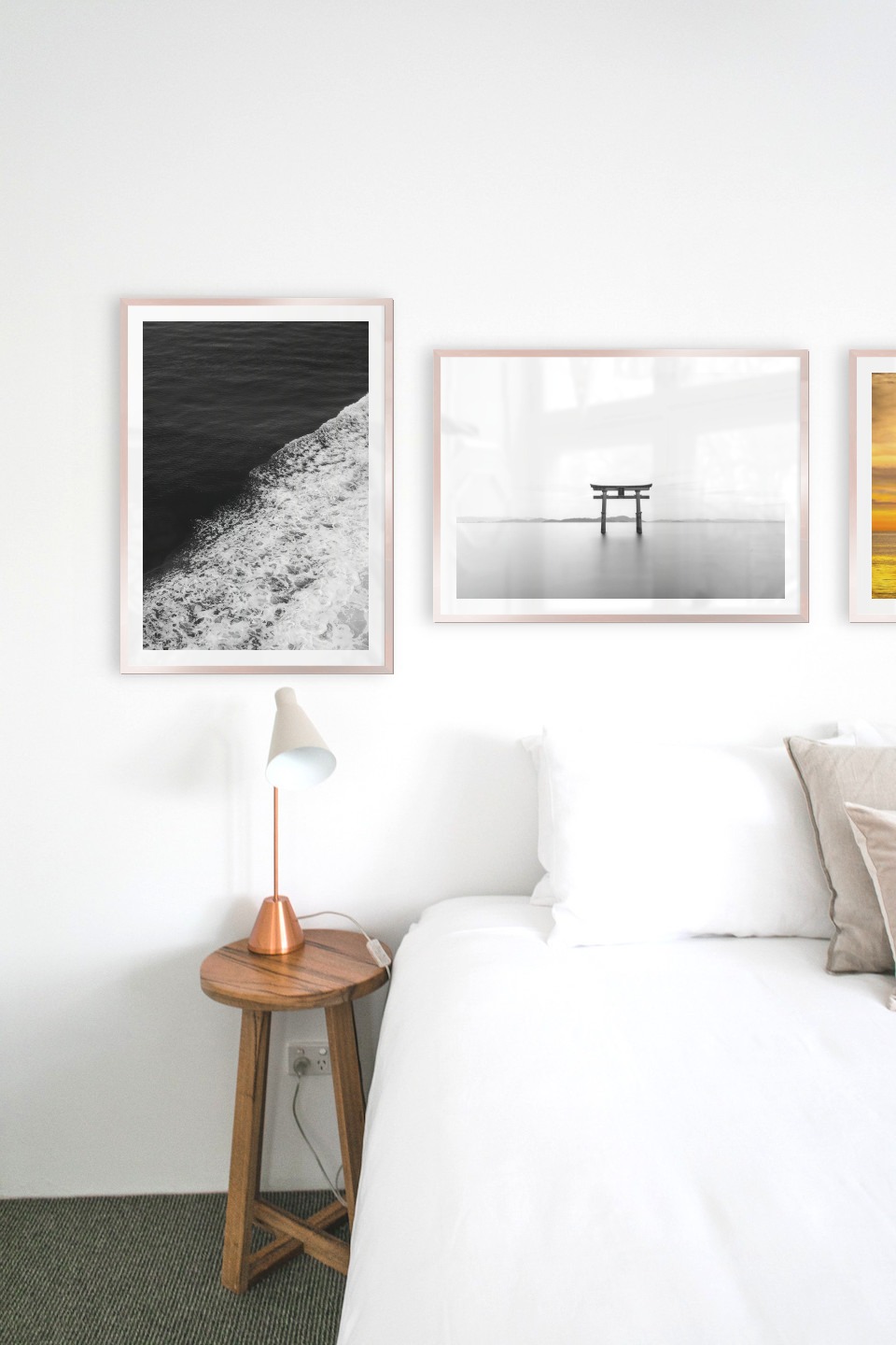 Gallery wall with picture frames in copper in sizes 50x70 with prints "Swell from waves", "Pillars in the water" and "Ships at sea"