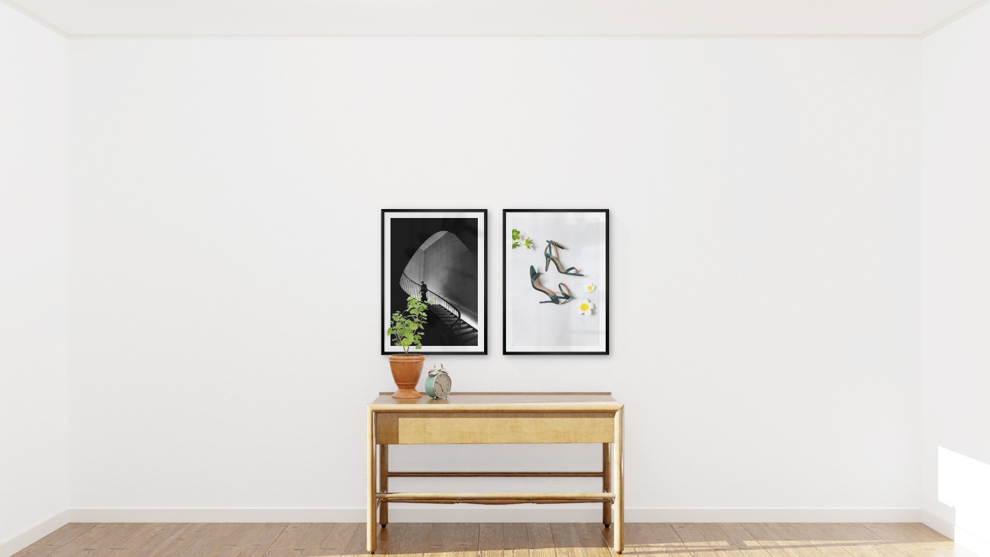 Gallery wall with picture frames in black in sizes 50x70 with prints "Staircase" and "Heels"