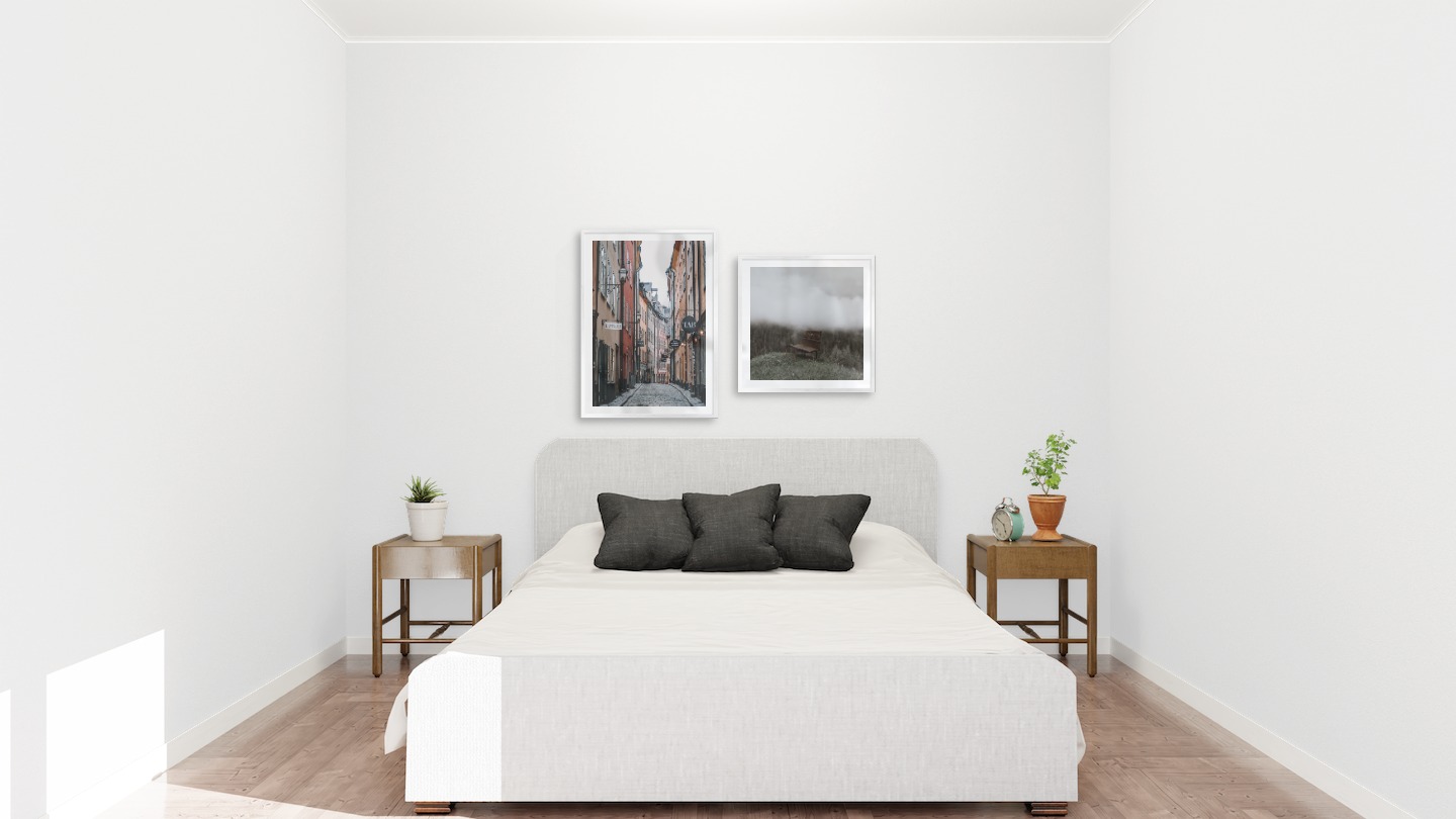 Gallery wall with picture frames in silver in sizes 50x70 and 50x50 with prints "Old town in Stockholm" and "Bench in misty nature"
