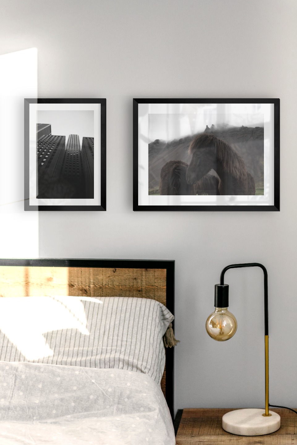 Gallery wall with picture frames in black in sizes 21x30 and 30x40 with prints "Golden Gate Bridge", "High buildings" and "Icelandic horses"