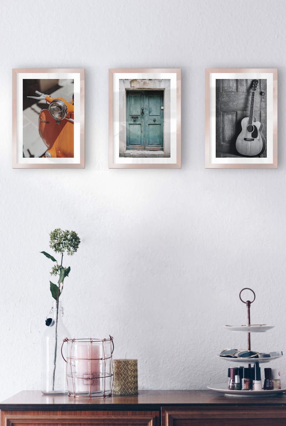 Gallery wall with picture frames in copper in sizes 21x30 with prints "Orange vespa", "Door" and "Guitar"
