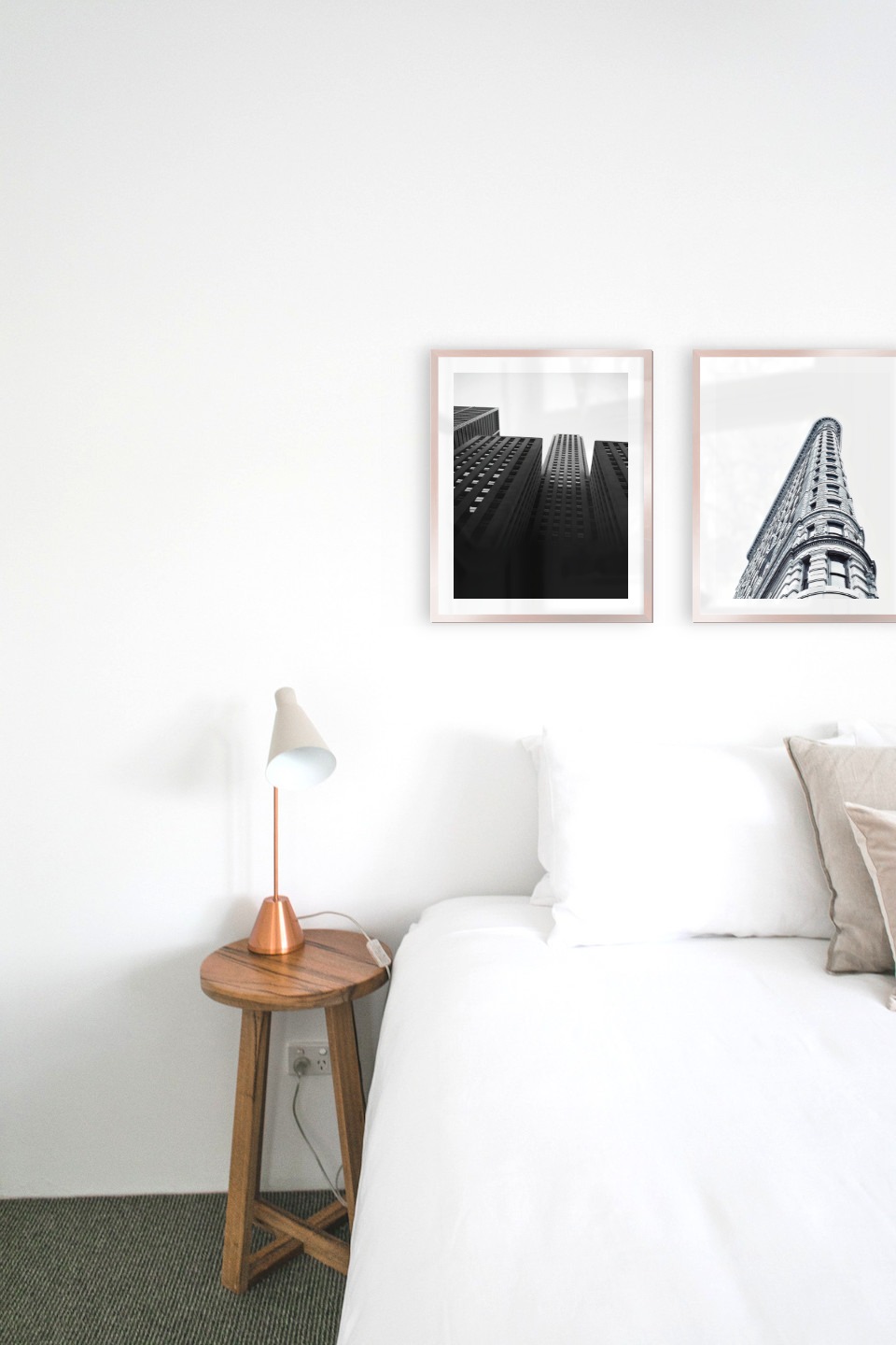 Gallery wall with picture frames in copper in sizes 40x50 with prints "High buildings" and "Gray building"