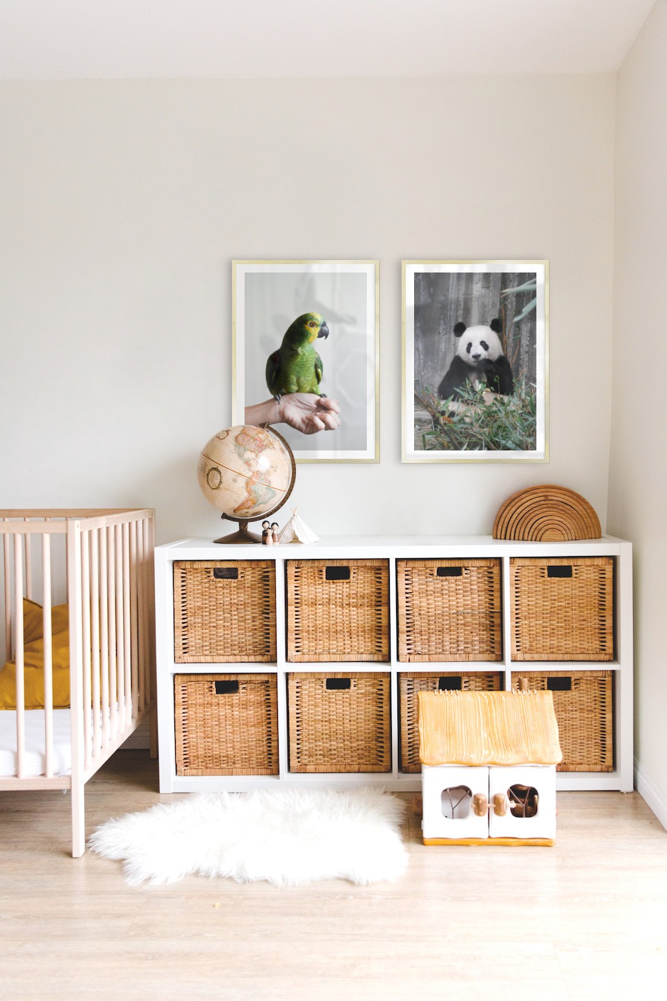 Gallery wall with picture frames in gold in sizes 50x70 with prints "Green parrot" and "Panda"