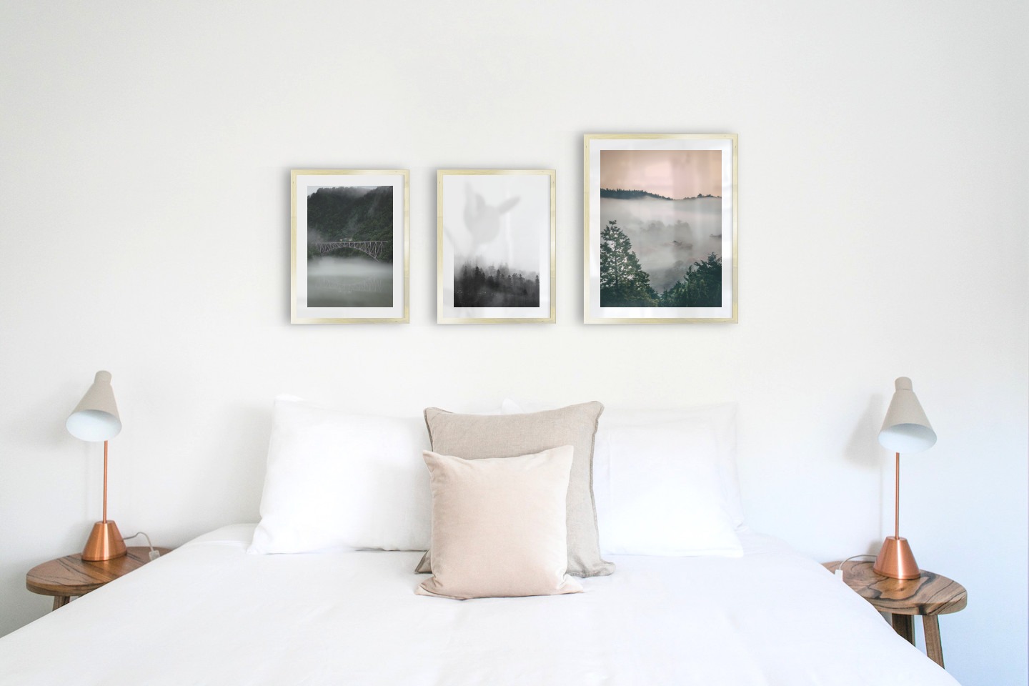 Gallery wall with picture frames in gold in sizes 30x40 and 40x50 with prints "Train over bridge", "Foggy wooden tops" and "Wooden tops and orange sky"