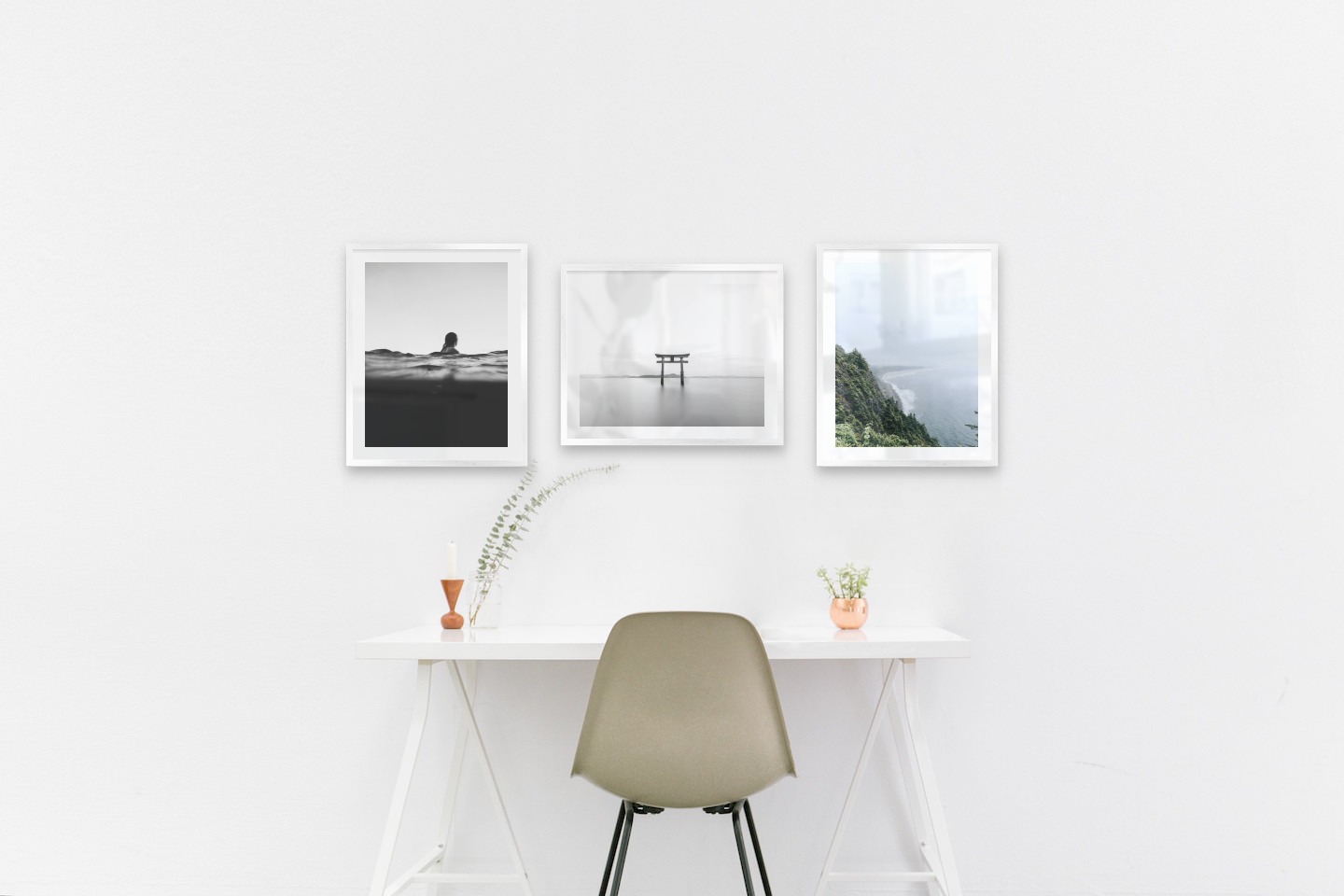 Gallery wall with picture frames in silver in sizes 40x50 with prints "Person in the water", "Pillars in the water" and "Rocks facing the water"