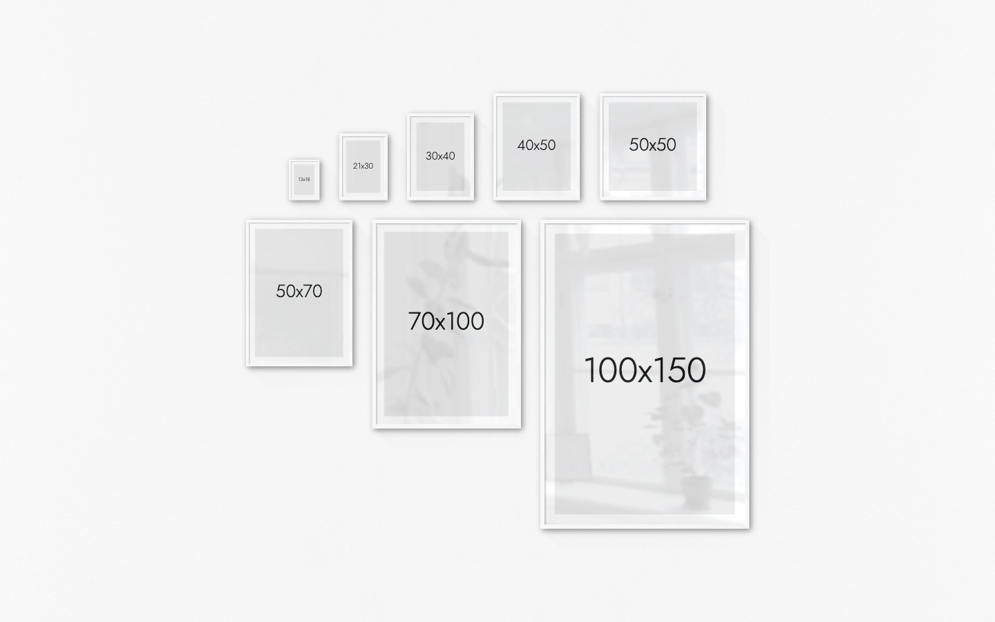 Gallery wall with picture frames in white in sizes 13x18, 21x30, 30x40, 40x50, 50x50, 50x70, 70x100 and 100x150