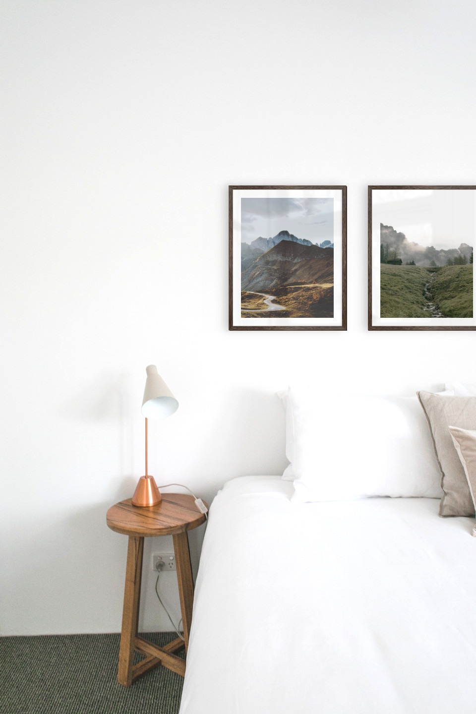 Gallery wall with picture frames in dark wood in sizes 40x50 with prints "Road among the mountains" and "Green valley in front of mountains"