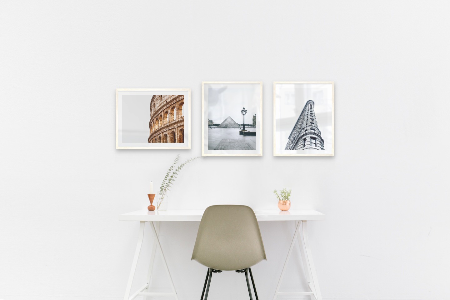 Gallery wall with picture frames in light wood in sizes 40x50 with prints "Colosseum and Rome", "Louvre in Paris" and "Gray building"