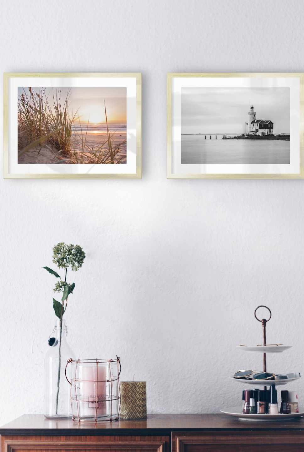 Gallery wall with picture frames in gold in sizes 30x40 with prints "Straw on the beach" and "Pier with building"