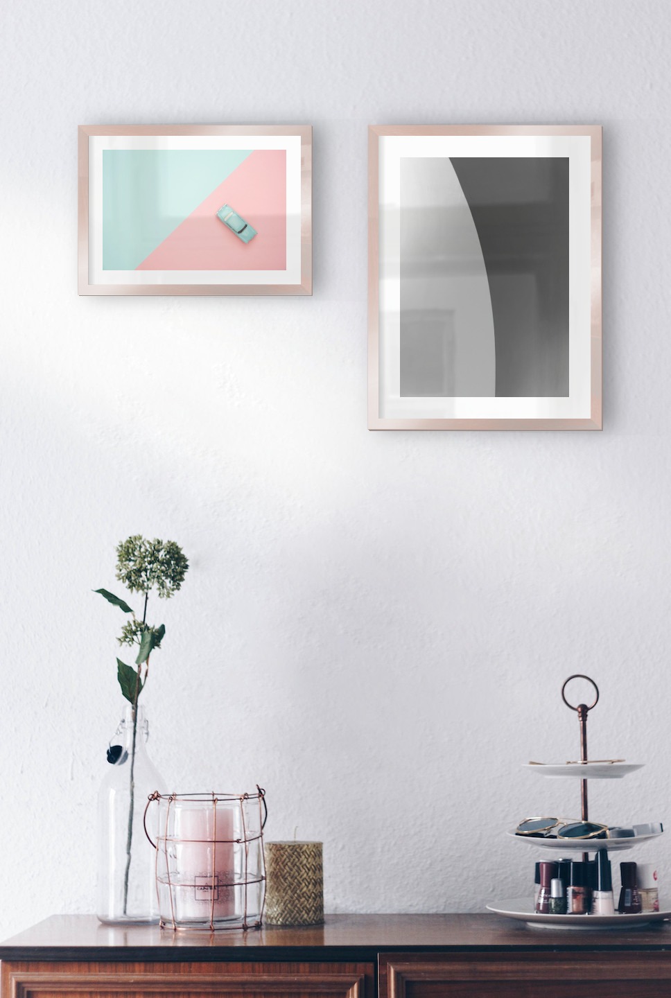 Gallery wall with picture frames in copper in sizes 21x30 and 30x40 with prints "Blue car and pink" and "Line"