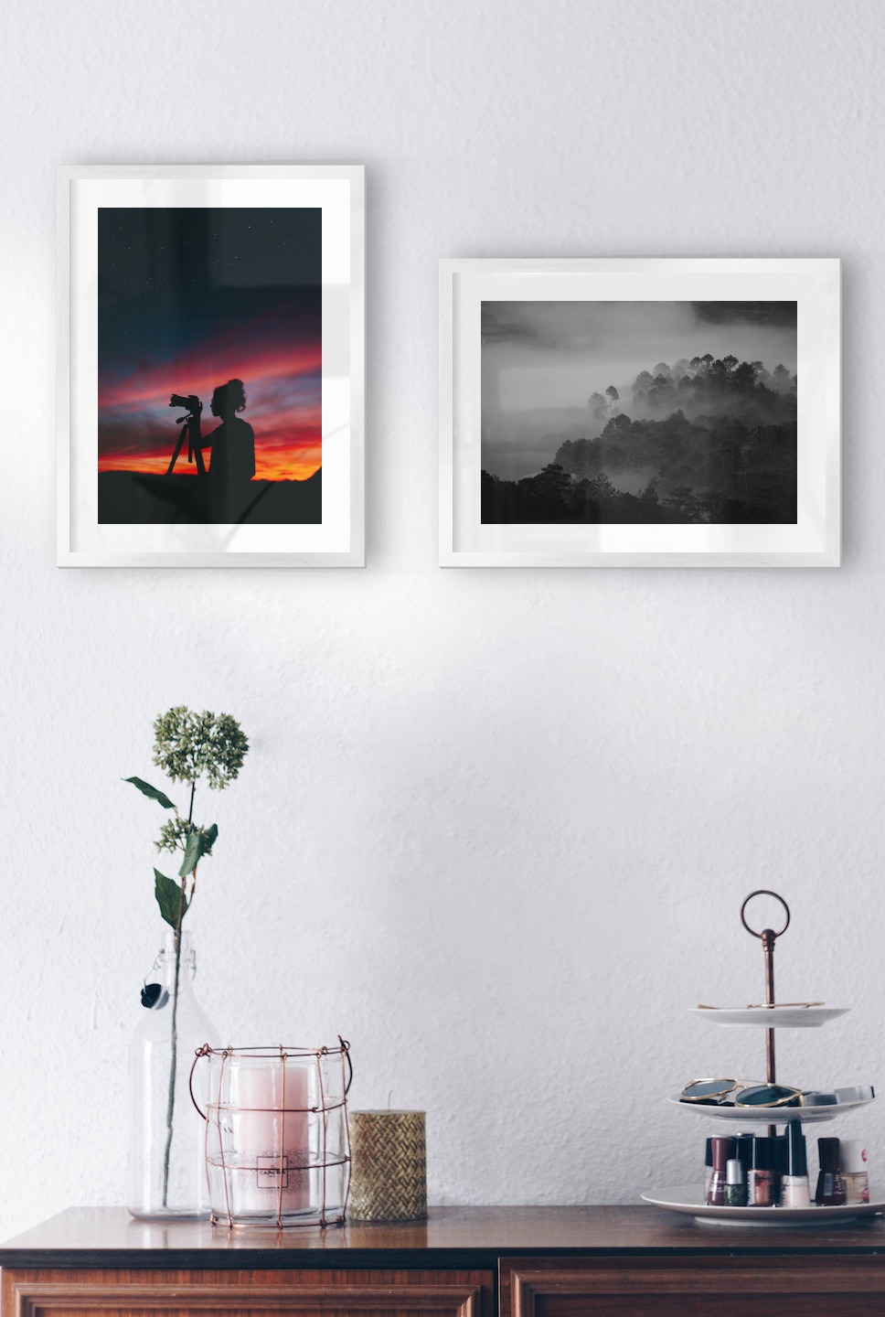 Gallery wall with picture frames in silver in sizes 30x40 with prints "Photographer at night" and "Foggy wooden tops"