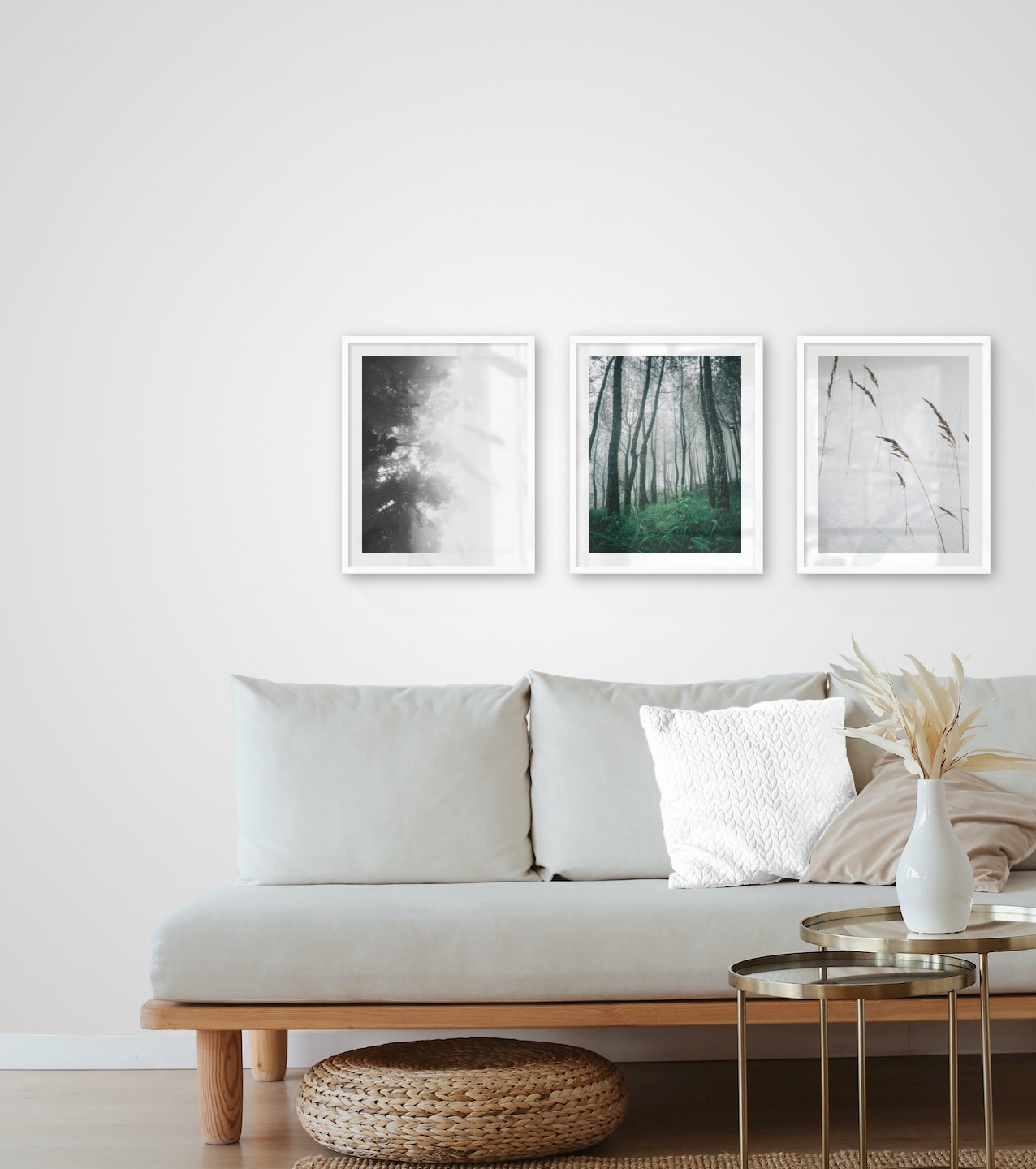 Gallery wall with picture frames in white in sizes 40x50 with prints "Foggy wooden tops from the side", "Tall trees" and "Sharp in the snow"
