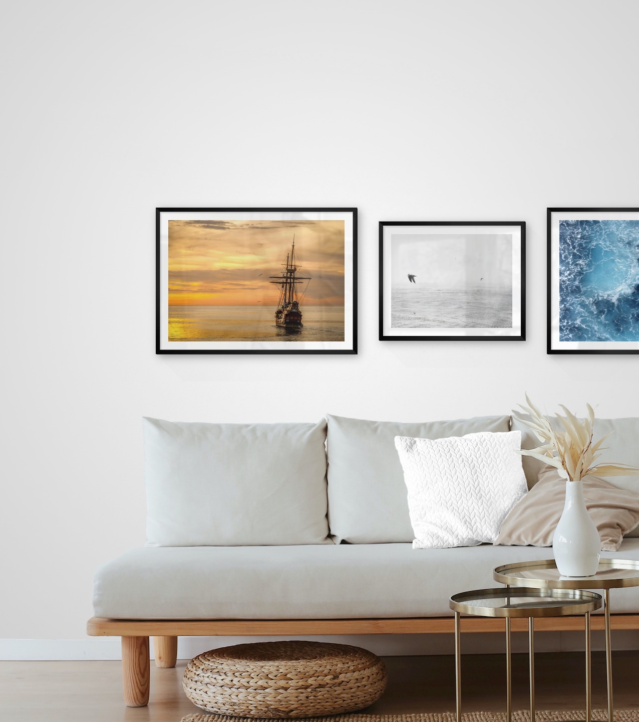 Gallery wall with picture frames in black in sizes 50x70 and 40x50 with prints "Ships at sea", "Birds over the sea" and "Sea from above"