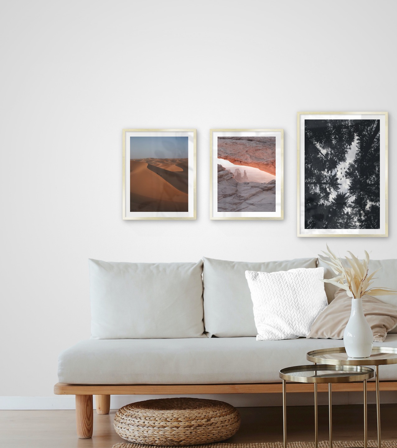 Gallery wall with picture frames in gold in sizes 40x50 and 50x70 with prints "Desert", "View between cliffs" and "Wooden tops and birds"