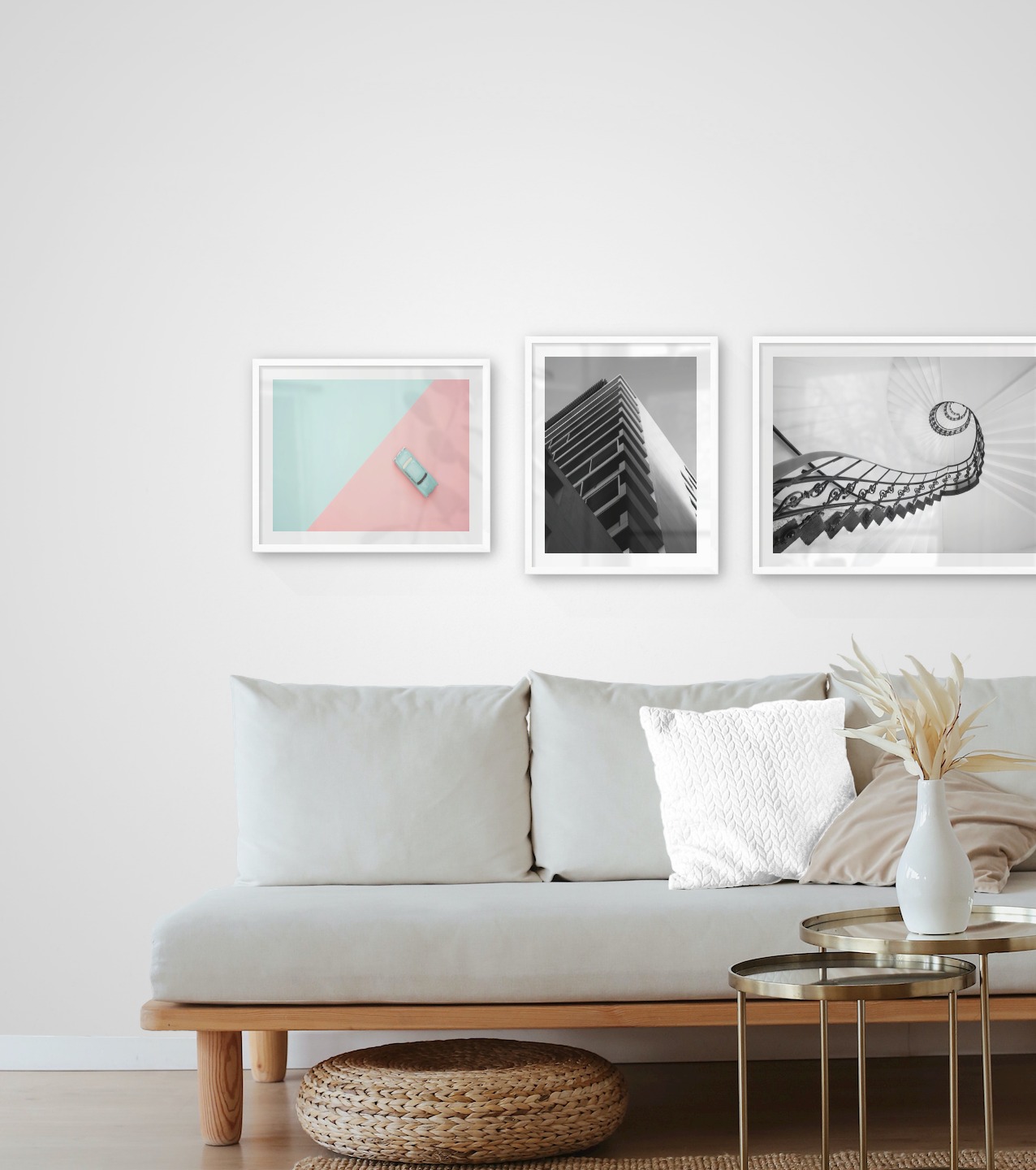 Gallery wall with picture frames in white in sizes 40x50 and 50x70 with prints "Blue car and pink", "Black and white building" and "Circular stair railing"