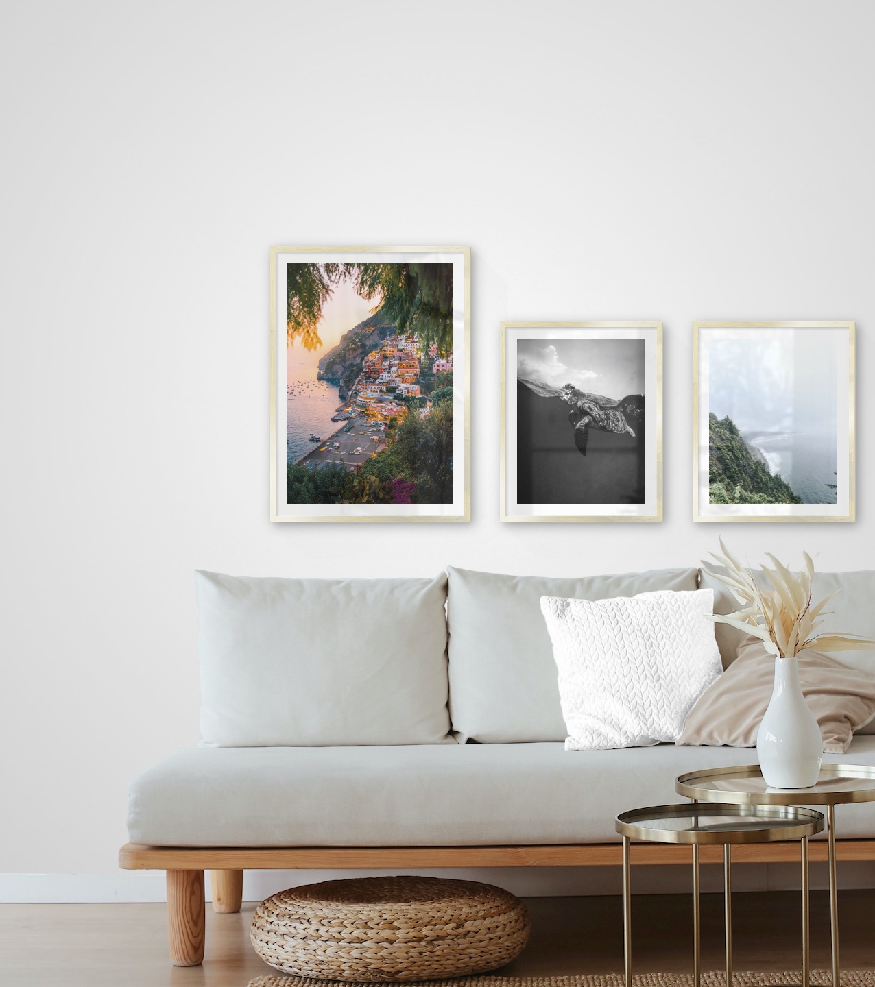 Gallery wall with picture frames in gold in sizes 50x70 and 40x50 with prints "City by the sea", "Turtle" and "Rocks facing the water"