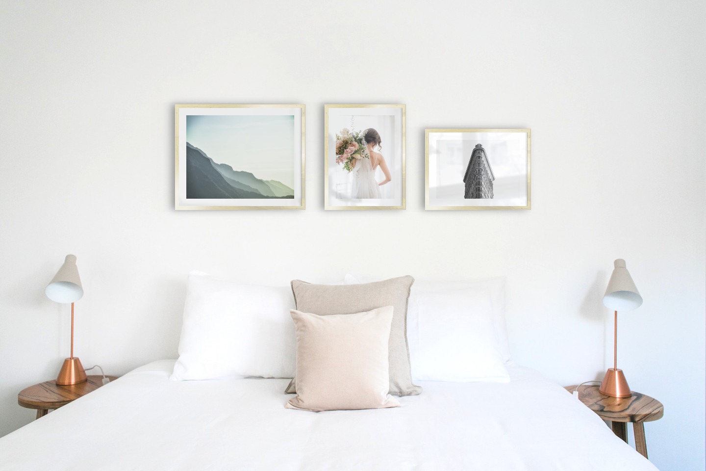 Gallery wall with picture frames in gold in sizes 40x50 and 30x40 with prints "Foggy mountain", "Bride and flowers" and "Triangular building"