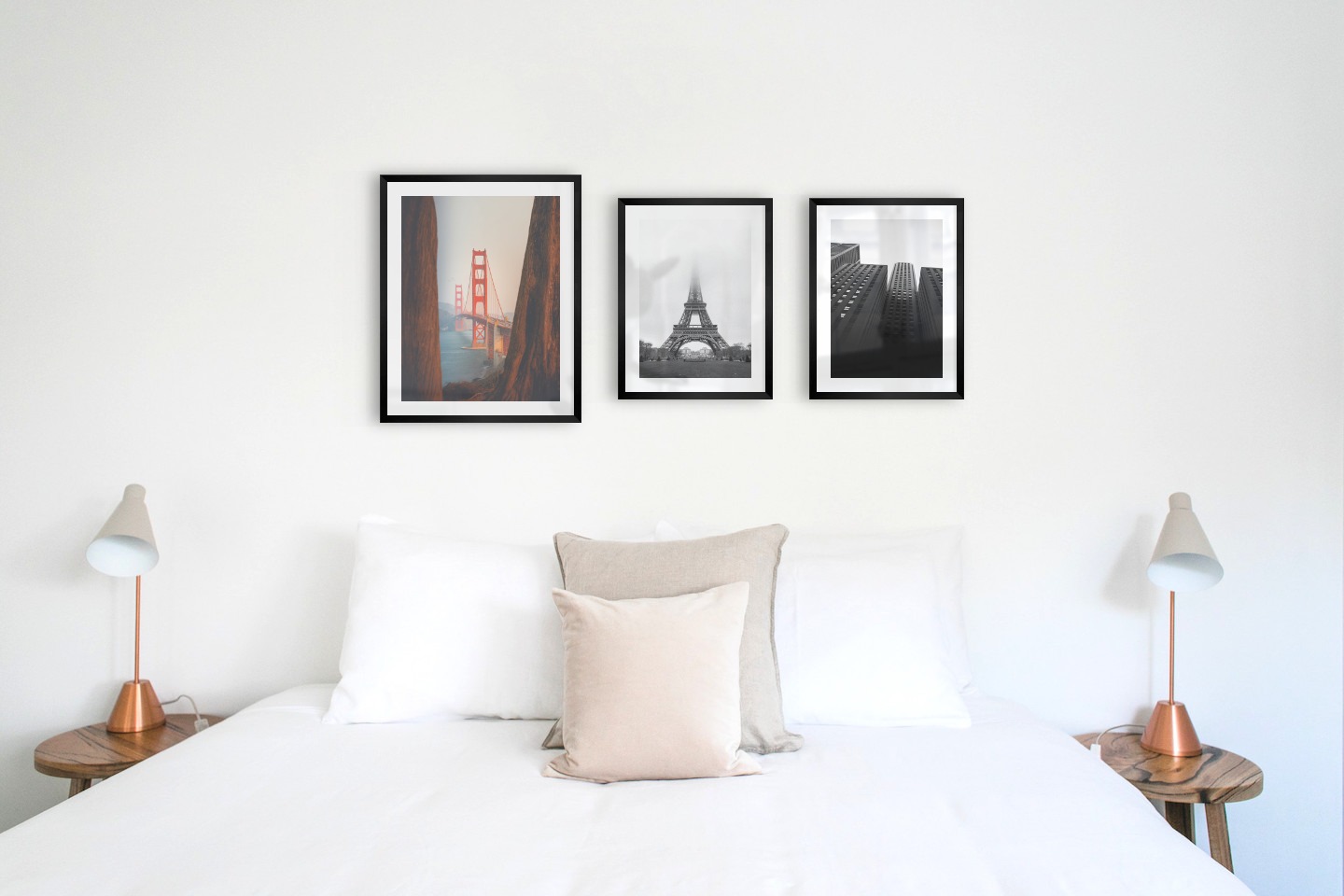 Gallery wall with picture frames in black in sizes 40x50 and 30x40 with prints "Golden Gate Bridge", "Eifel tower with fog" and "High buildings"