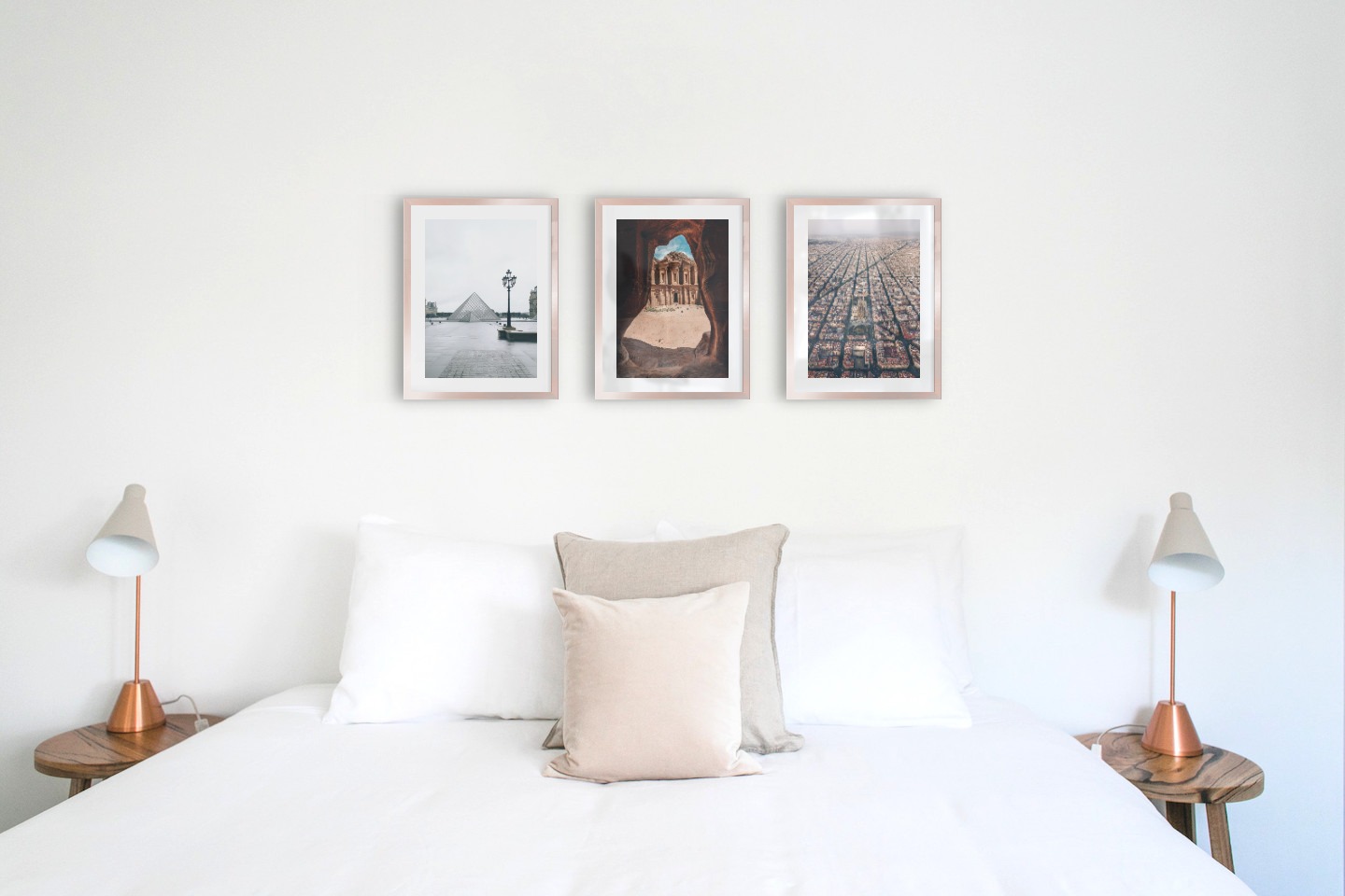 Gallery wall with picture frames in copper in sizes 30x40 with prints "Louvre in Paris", "Petra in Jordan" and "Barcelona city center"