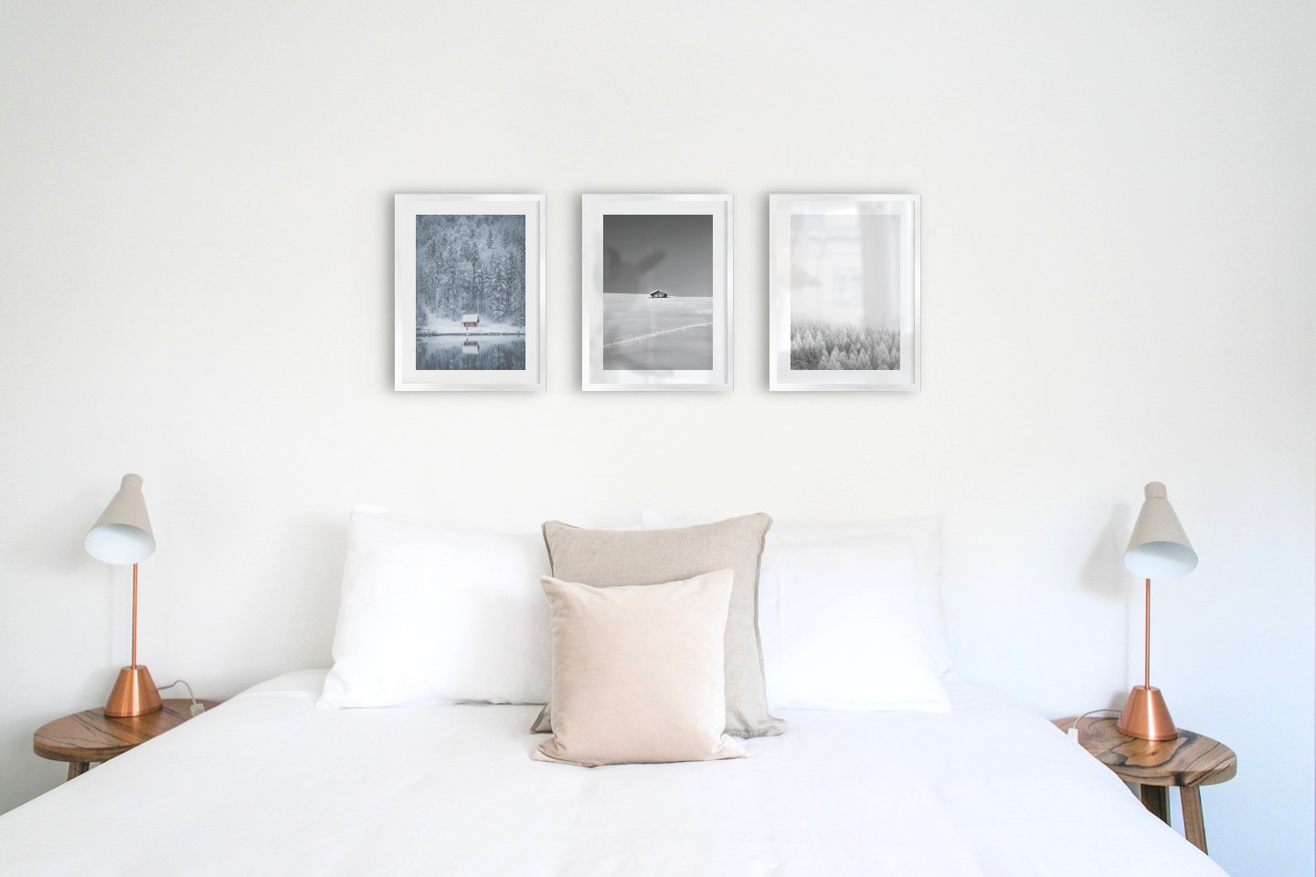 Gallery wall with picture frames in silver in sizes 30x40 with prints "Cottage by the lake", "Cottage in the snow" and "Wooden tops in winter"