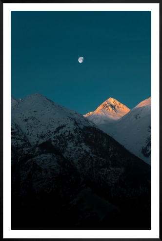 Gallery wall with picture frame in black in size 100x150 with print "Moon over mountains"