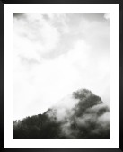 Gallery wall with picture frame in black in size 40x50 with print "Trees and mountains in fog"