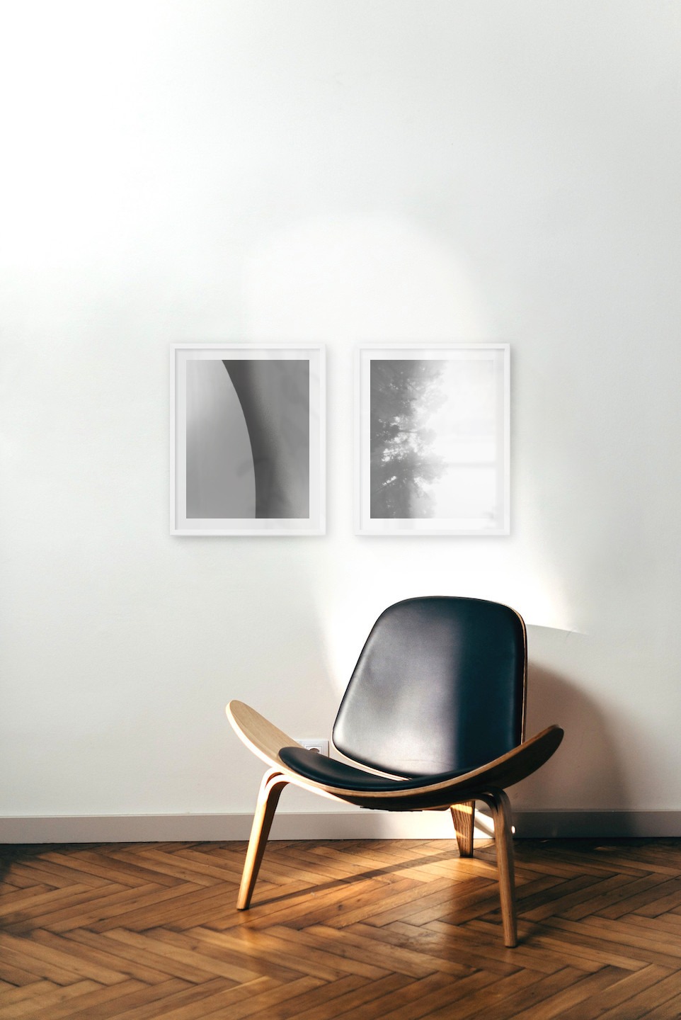Gallery wall with picture frames in white in sizes 40x50 with prints "Line" and "Foggy wooden tops from the side"
