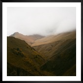 Gallery wall with picture frame in black in size 50x50 with print "Foggy valley"