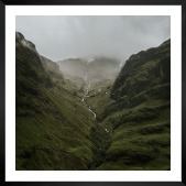 Gallery wall with picture frame in black in size 50x50 with print "Stream in valley"