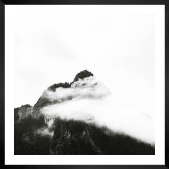 Gallery wall with picture frame in black in size 50x50 with print "Mountain peaks in fog"