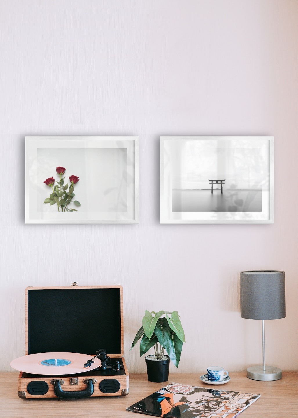 Gallery wall with picture frames in silver in sizes 30x40 with prints "Red roses" and "Pillars in the water"